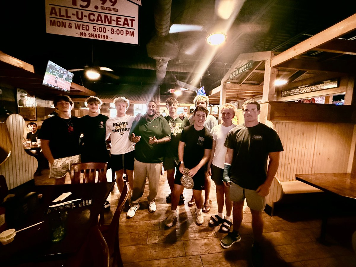 A group of guys hanging out together on a night out